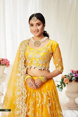 Yellow embroidered net semi stitched lehenga 3