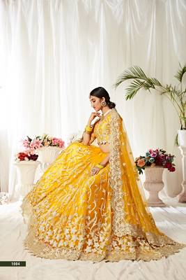 Yellow embroidered net semi stitched lehenga 4