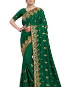Dark green vichitra silk embriodered saree with blouse piece.