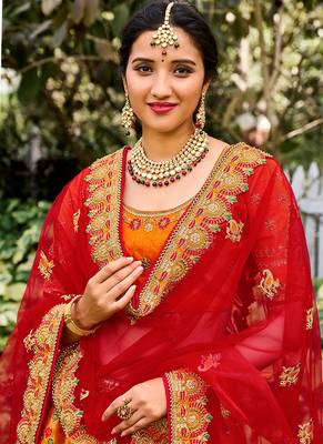 Orange Silk Bridal Designer lehnga with Heavy Embroidery 2