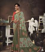 Light green embroidered jute saree with blouse