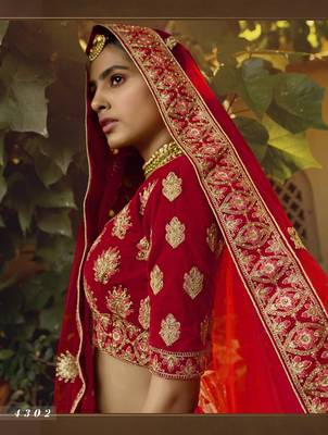 Red embroidered velvet semi stitched lehenga 4