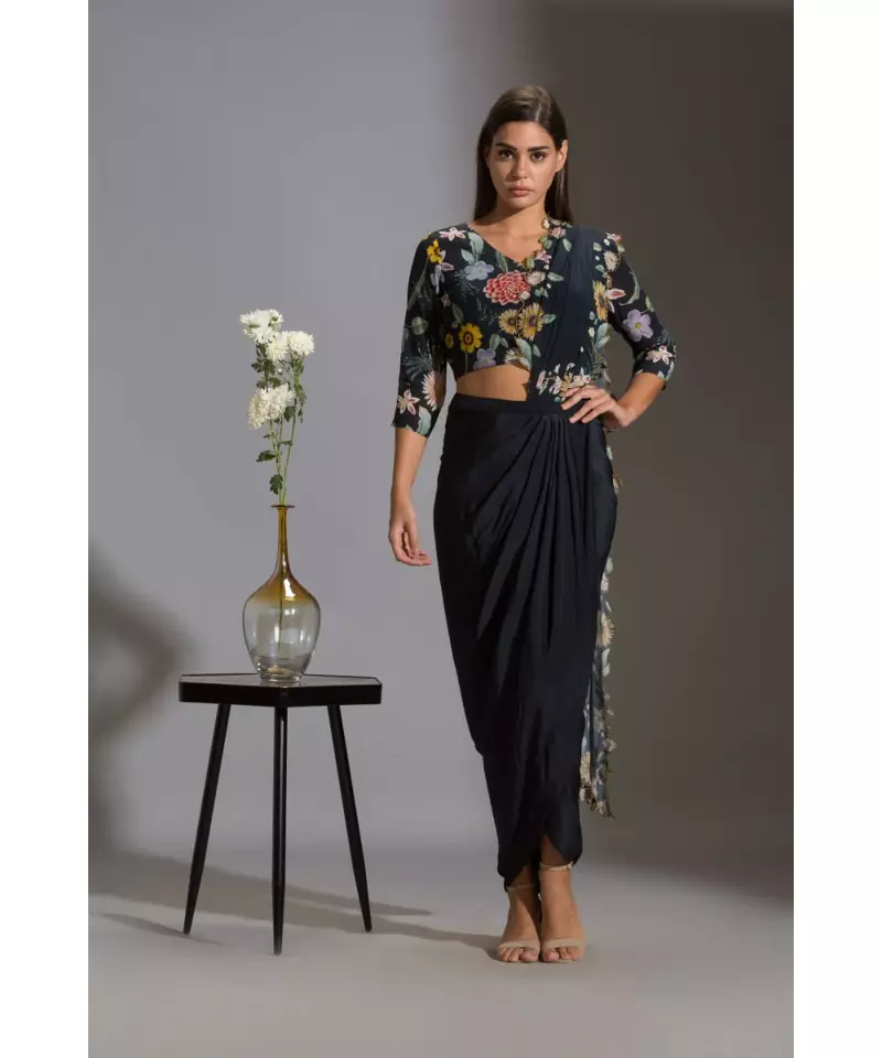 drape saree with cutwork embroidery paired with v neck blouse