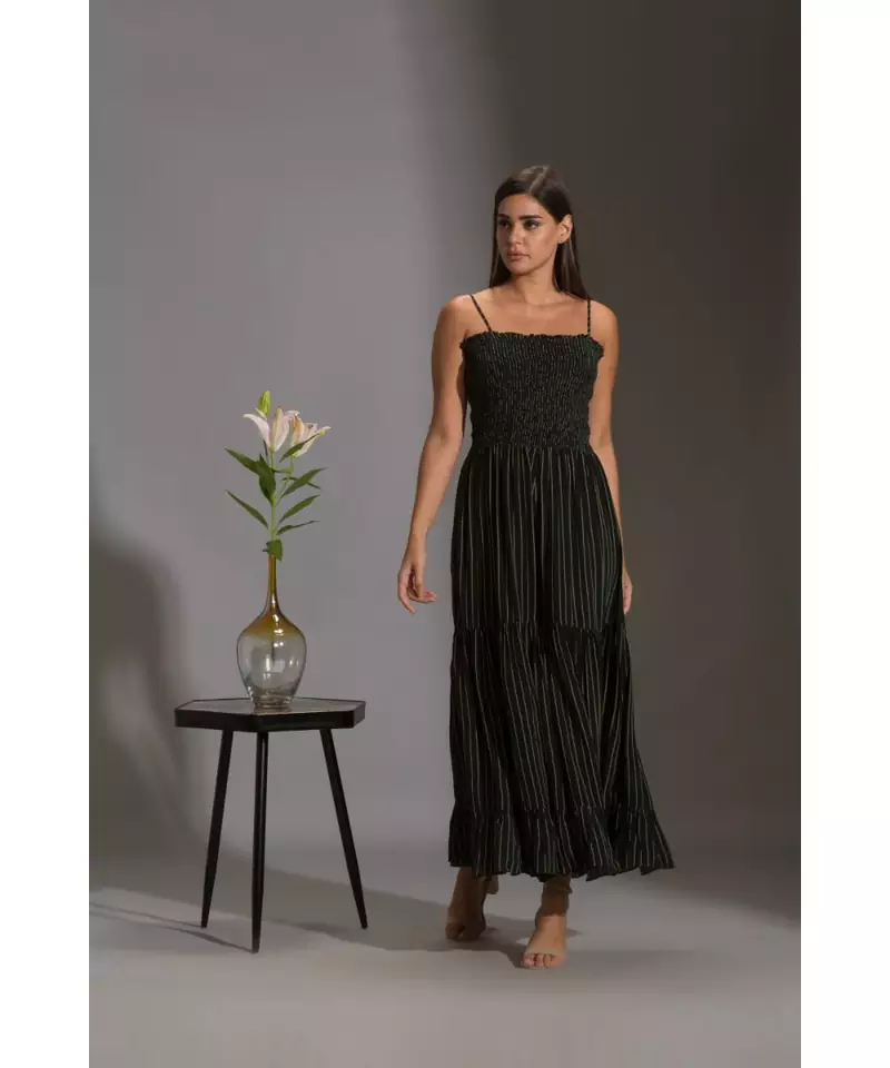printed rushed jumpsuit with belt and paired with sequence cape
