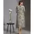 printed drape dress with side cuts paired with printed jackets and tassel detail