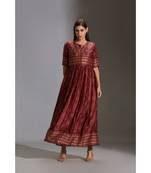 printed dress paired with sleeveless jacket