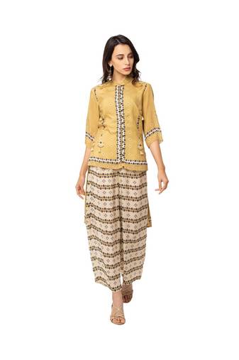 high low hem top with button detail is paired with flared pants