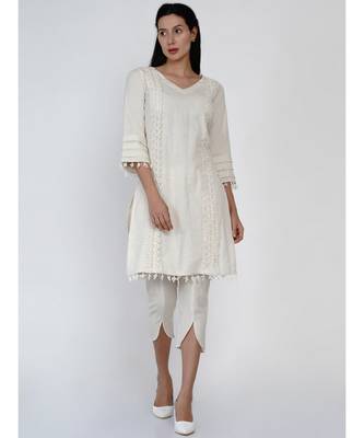 women set of off white cotton flex kurta with lace work on princess seam, tiered sleeves with co-ordinated petal pants 1