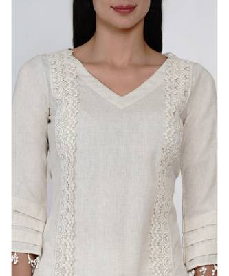 women set of off white cotton flex kurta with lace work on princess seam, tiered sleeves with co-ordinated petal pants 2