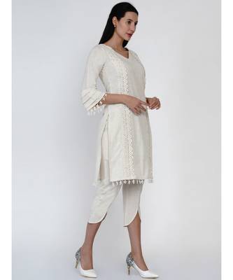 women set of off white cotton flex kurta with lace work on princess seam, tiered sleeves with co-ordinated petal pants 3