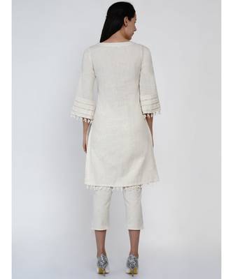 women set of off white cotton flex kurta with lace work on princess seam, tiered sleeves with co-ordinated petal pants 5