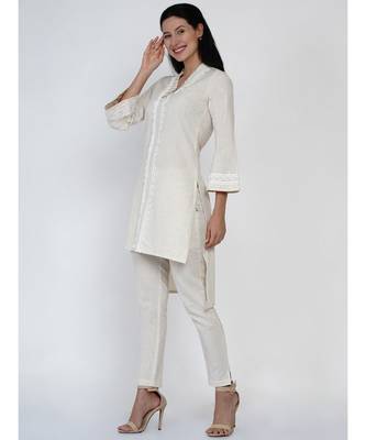 women off white cotton flex high low kurta with pleats and lace work at neck and sleeve hem 2