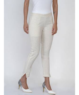 women off white cotton pant with lace work at hem 1