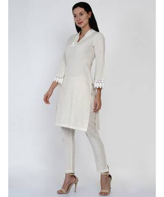 women off white cotton flex v neck kurta with lace work on neck and sleeve hem 2