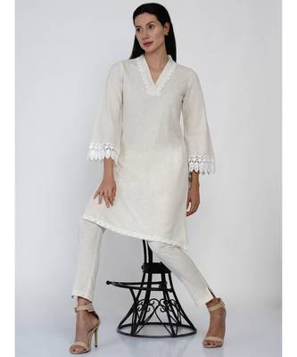 women off white cotton flex v neck kurta with lace work on neck and sleeve hem 4