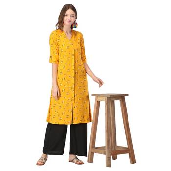 Yellow printed rayon kurtas-and-kurtis 5