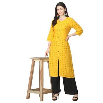 Yellow printed rayon kurtas-and-kurtis 5