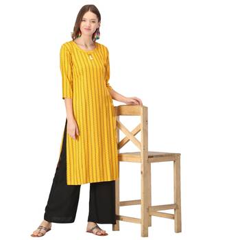 Yellow printed rayon kurtas-and-kurtis 5