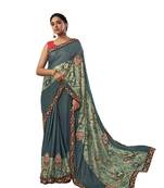 Turquoise embroidered jute saree with blouse