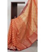 Orange silk cotton benaras brocade with antique zari butties on body, pallu and border saree