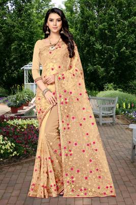 Golden embroidered net saree with blouse 1