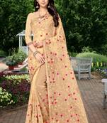 Golden embroidered net saree with blouse