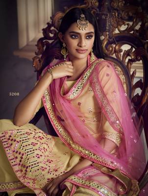 Beige Colored Thread Embroidered With Foil Mirror Work Organza Gharara Type Sharara Suit For Festive 2