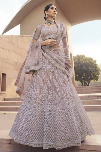Ravishing Mauve Purple Thread and Sequins embroidered net Semi Stitched Lehenga Choli for Bride
