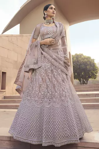 Ravishing Mauve Purple Thread and Sequins embroidered net Semi Stitched Lehenga Choli for Bride