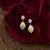 Sangeeta Boochra Silver Earrings With Gold Plating