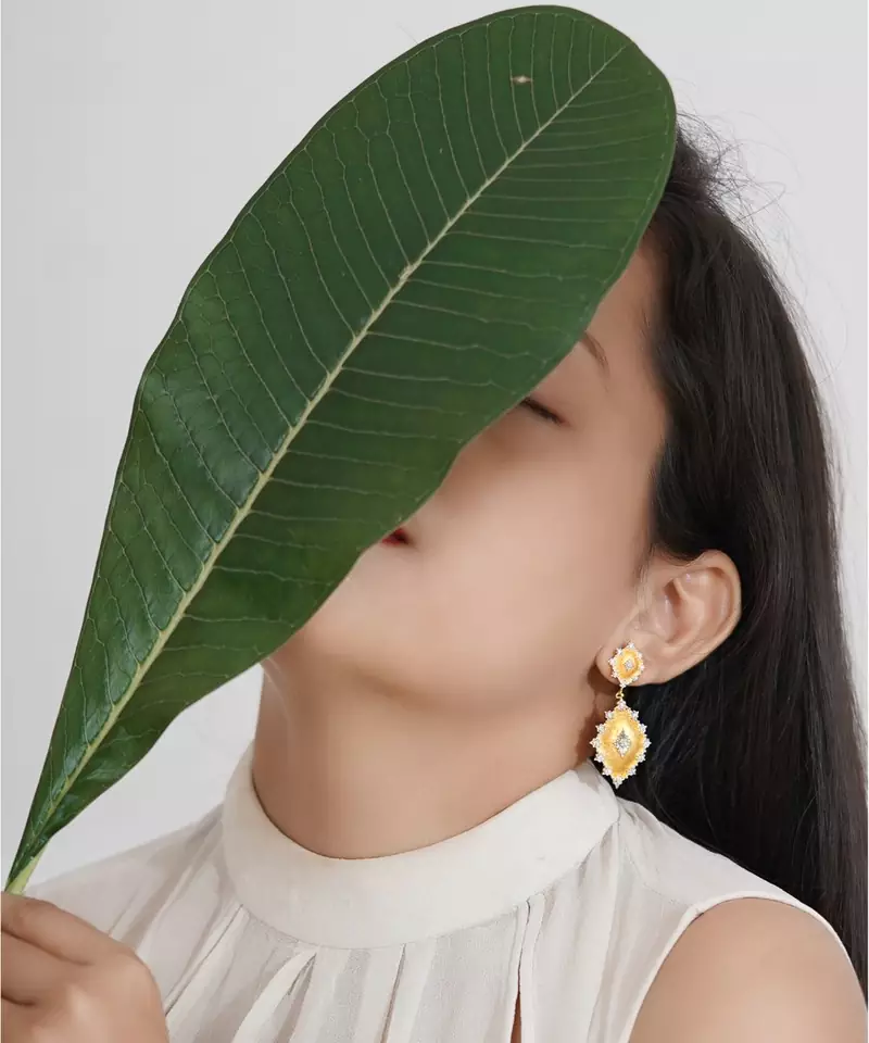 Sangeeta Boochra Silver Earrings With Gold Plating