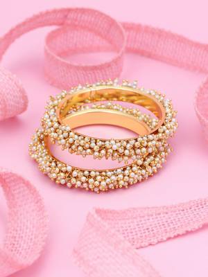 Gold pearl bangles and bracelets 1
