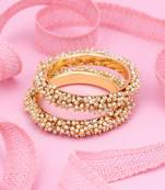 Gold pearl bangles and bracelets
