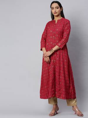 Fuchsia And Gold Geometric Printed A Line Kurta With quarter Sleeves. 1