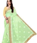 Light green embroidered net saree with blouse