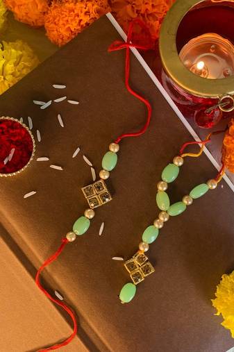 Gold Plated Stone Studded Pearl Rakhi and lumba Set for Bhaiya Bhabhi 