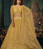 Cream thread embroidery net semi stitched lehenga