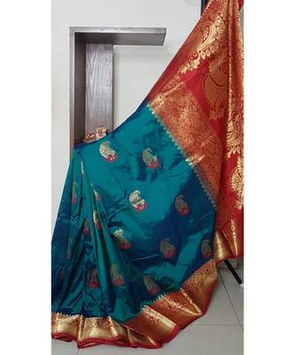 Teal with red pure handloom silk with paisley booties all over and intricate floral motifs on pallu and border. 1