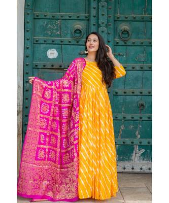 This is upada silk gown with hand tie and die leheriya along with banarsi dupatta 1