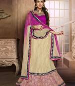 Beige embroidered net semi stitched lehenga