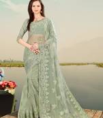 Light green embroidered net saree with blouse