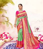 Green woven silk blend saree with blouse