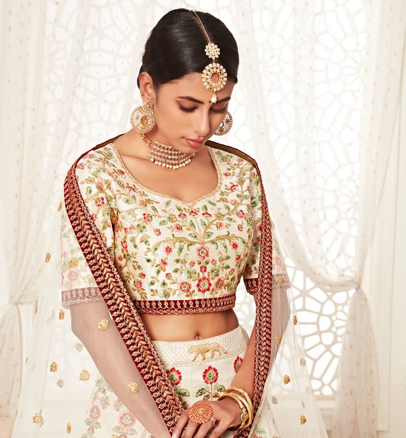 Marvelous Off-white Art Silk Embroidered Lehenga Choli with Diamond Work