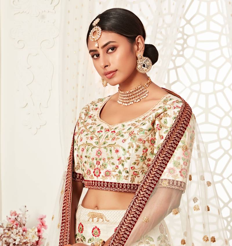 Marvelous Off-white Art Silk Embroidered Lehenga Choli with Diamond Work