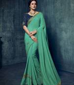 Green embroidered silk blend saree with blouse
