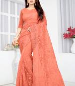 Peach embroidered net saree with blouse