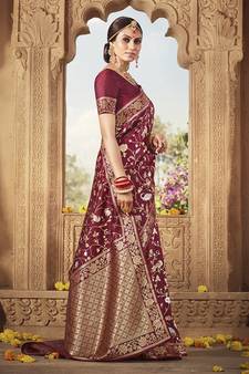 Maroon woven Banarasi silk blend saree with blouse
