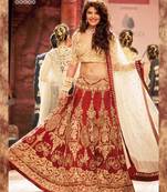 jacqueline Fernandez in red bridal lehenga on ramp