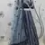 GREY SEQUINS EMBROIDERED NET SEMI STITCHED BRIDAL LEHENGA