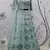 TURQUOISE-BLUE SEQUINS EMBROIDERED NET SEMI STITCHED BRIDAL LEHENGA
